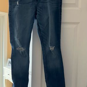 Hollister super skinny jeans. 32w 33l. Torn knee design and one on upper thigh.